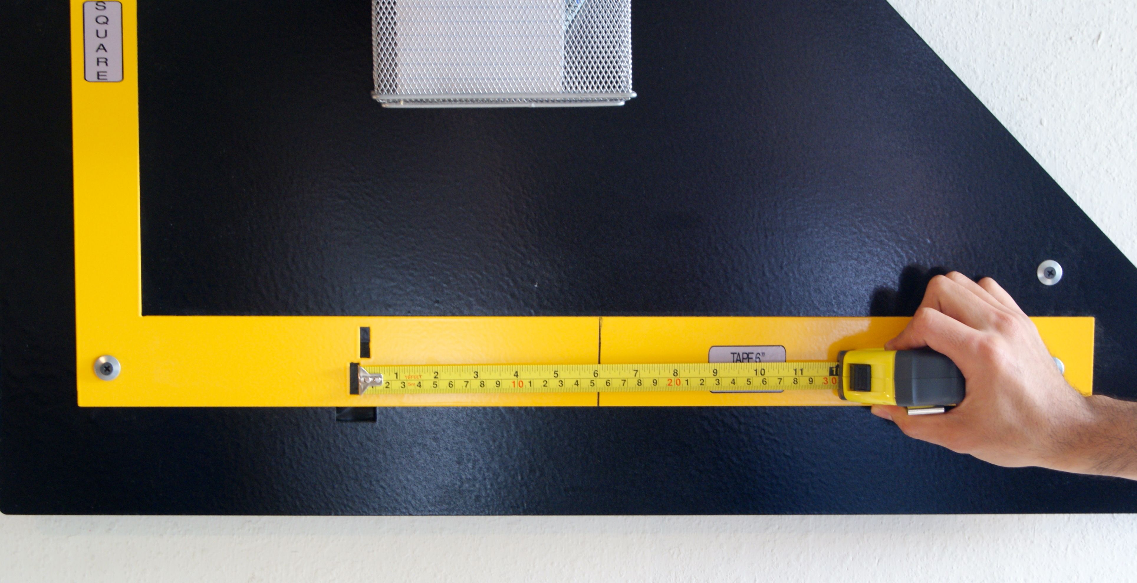 Photo of calibrating tape measure by pulling.