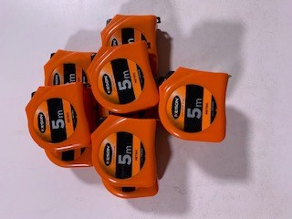 Pile of 5m calibrated tape measures
